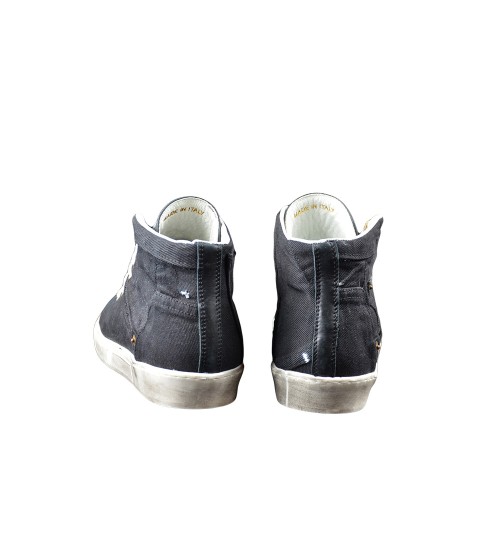 Handmade shoe black leather and black fashion material.